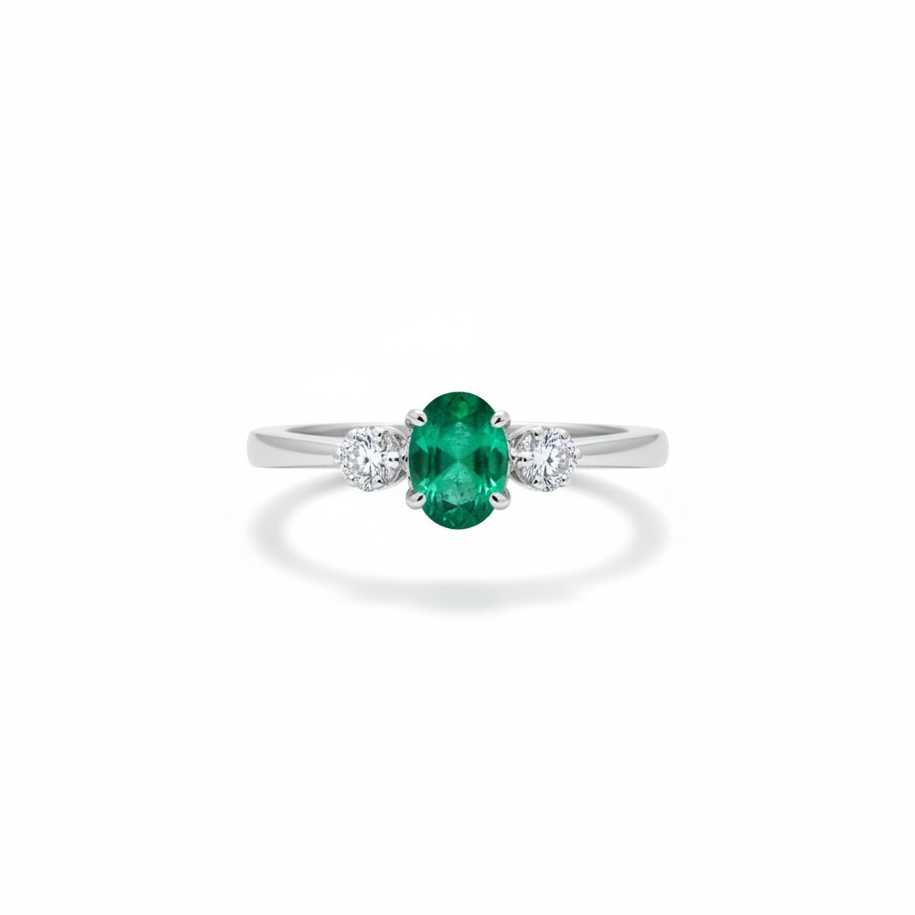 Anillo de esmeralda oval con dos diamantes laterales en oro blanco 14k