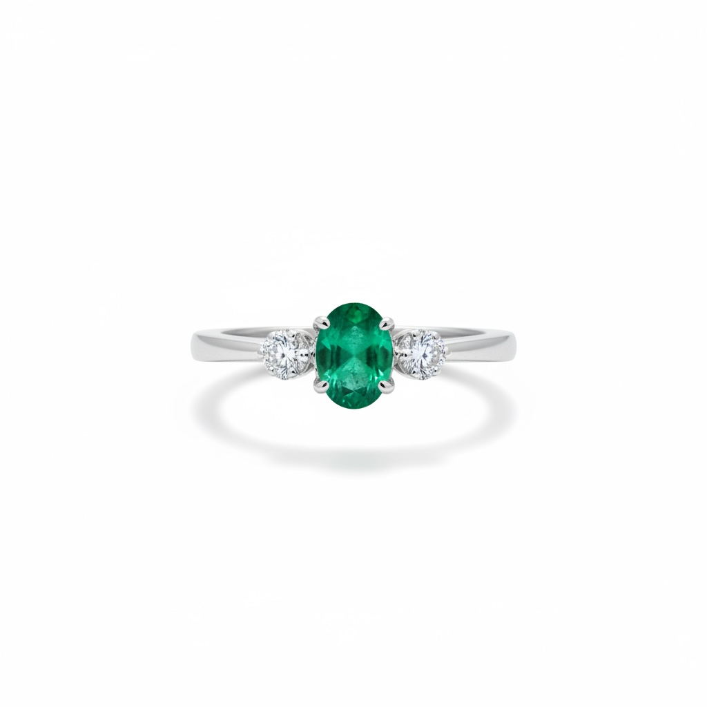 Anillo de esmeralda oval con dos diamantes laterales en oro blanco 14k